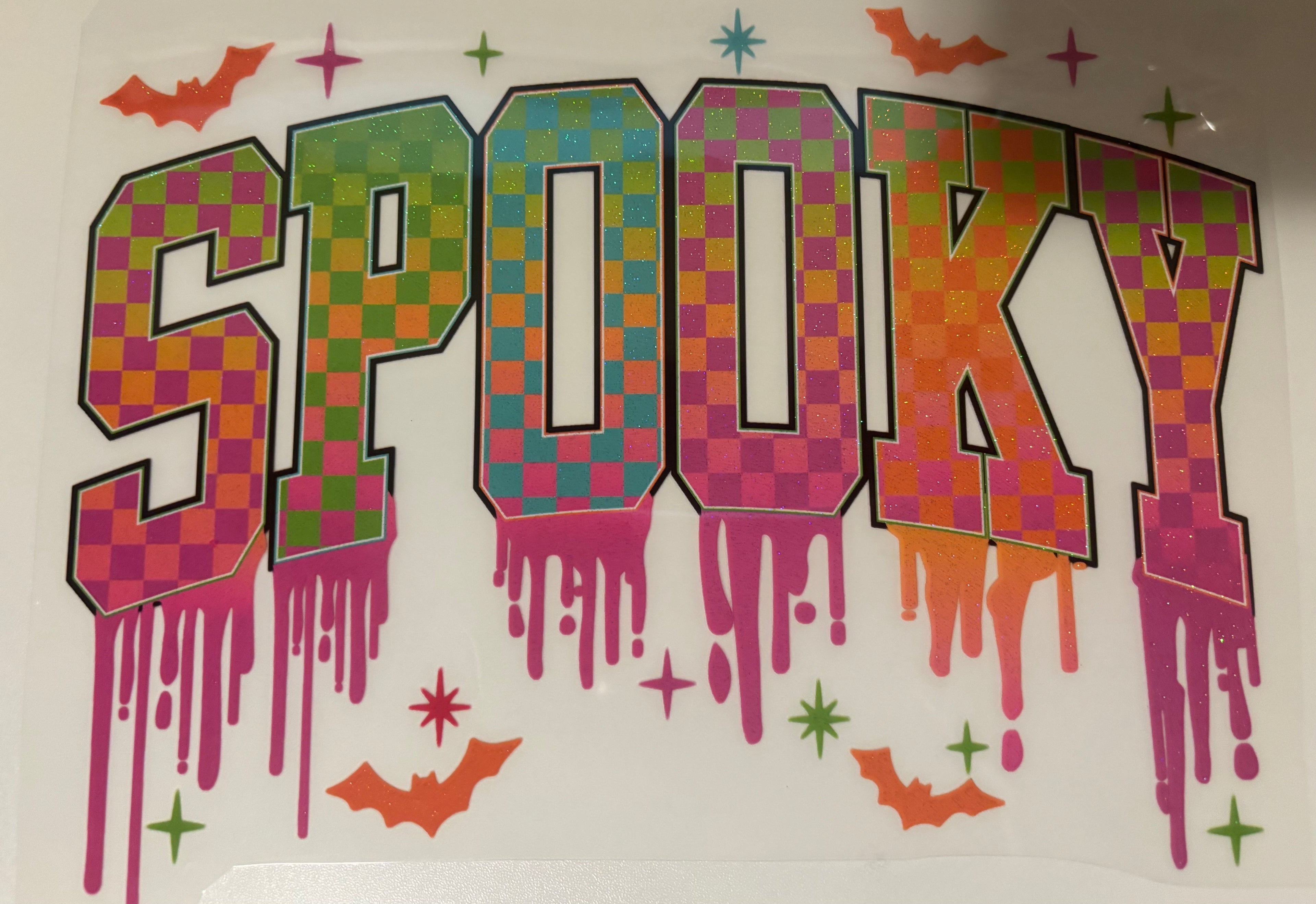 Glitter checkered spooky tee design