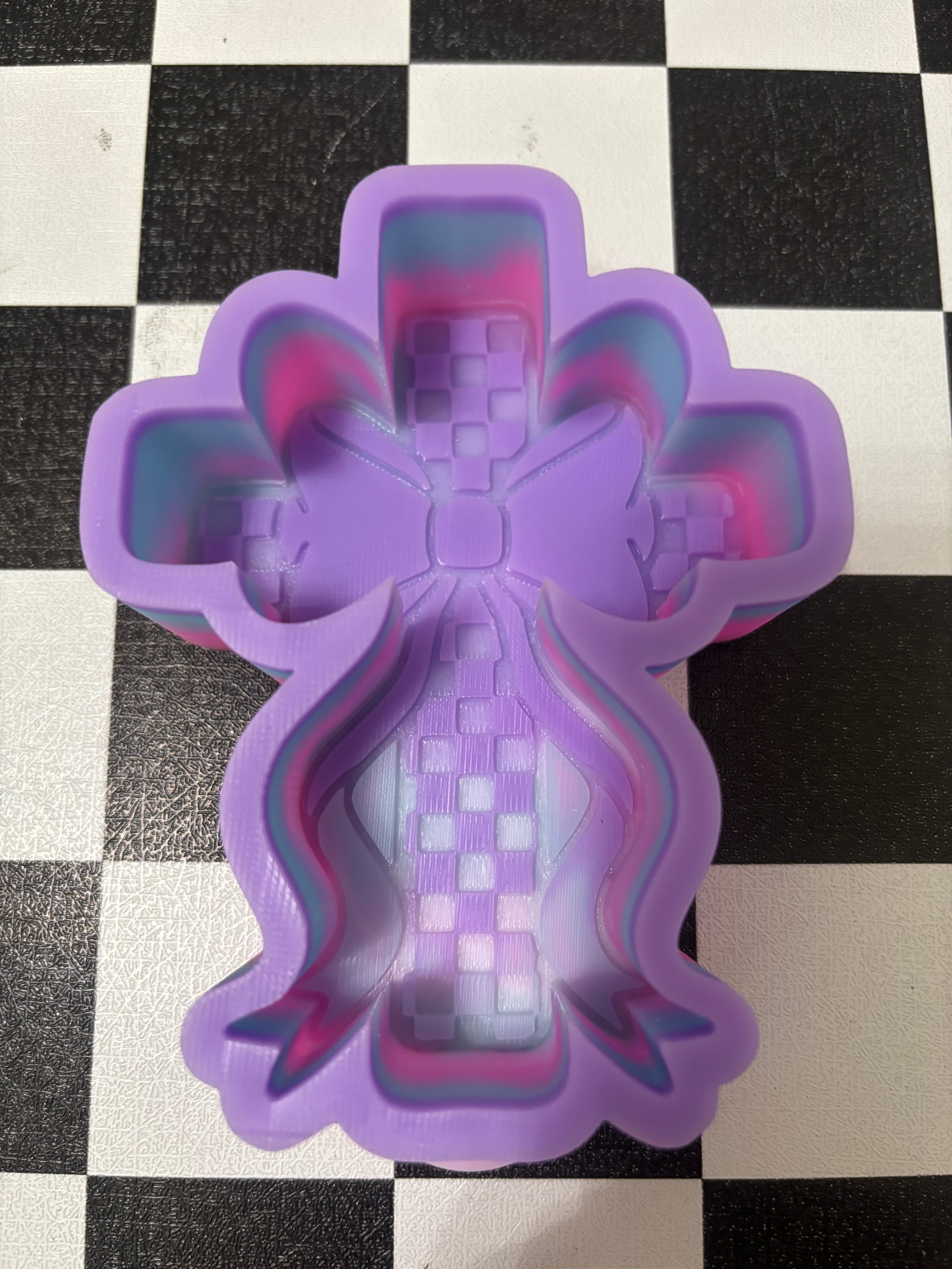 Custom checkered cross with bow freshie mold
